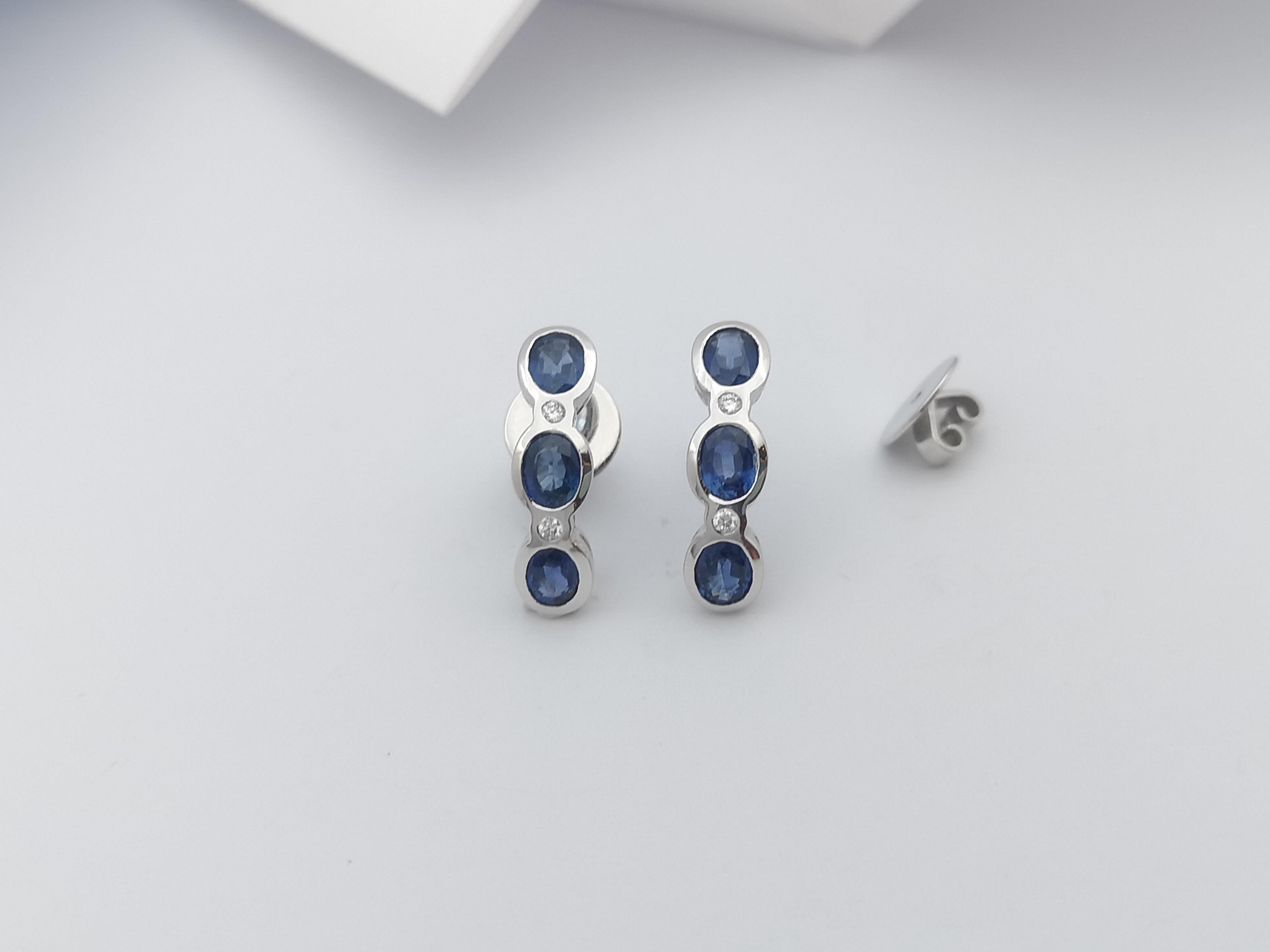 Oval Cut Blue Sapphire with Diamond  Earrings set in 18 Karat White Gold Settings For Sale