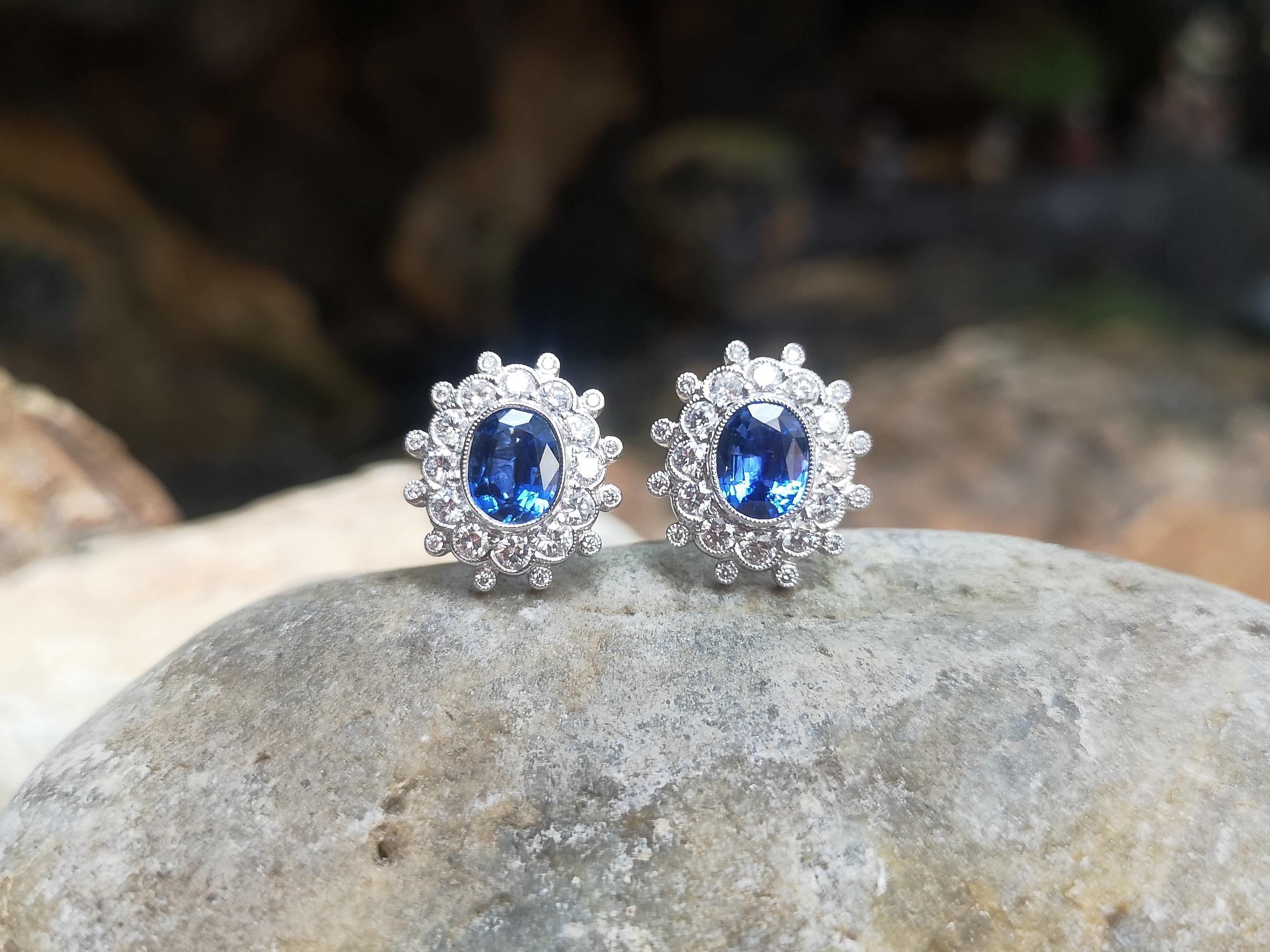 Women's Blue Sapphire with Diamond Earrings Set in 18 Karat White Gold Settings For Sale