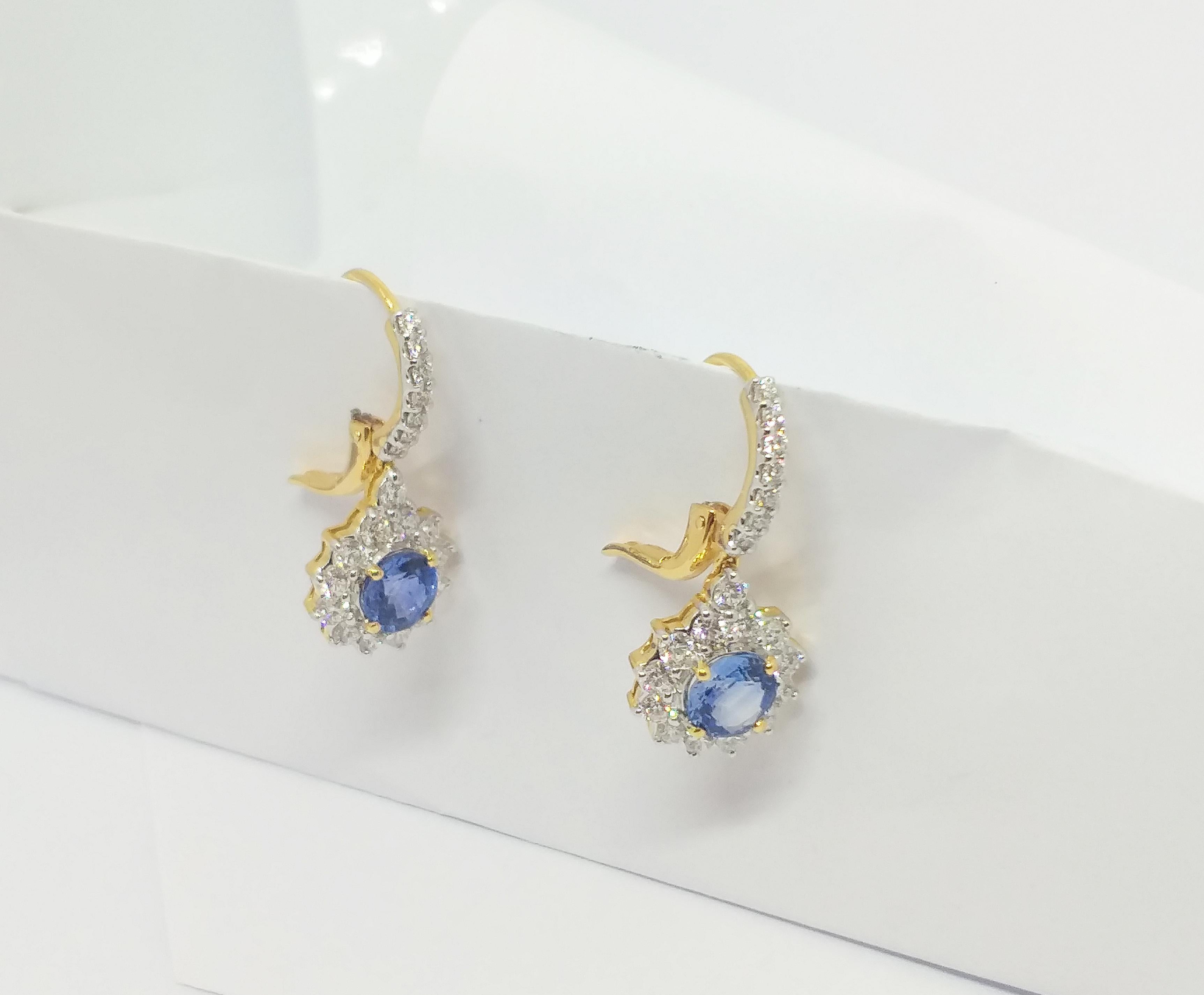 Round Cut Blue Sapphire with Diamond Earrings set in 18K Gold Settings For Sale