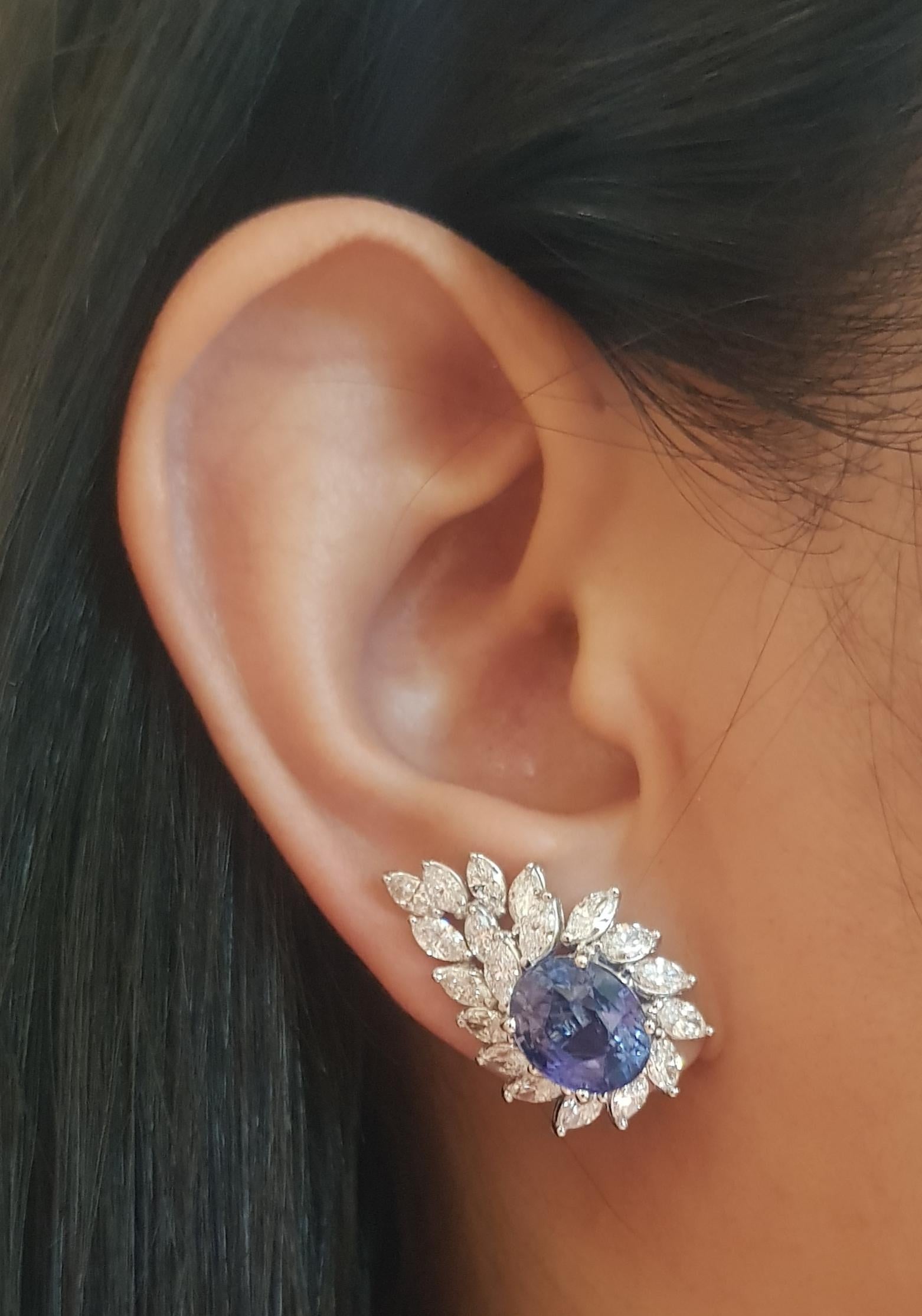 Blue Sapphire 9.26 carats with Diamond 3.62 carats Earrings set in 18K White Gold Settings

Width: 1.6 cm 
Length: 2.6 cm
Total Weight: 11.68 grams

