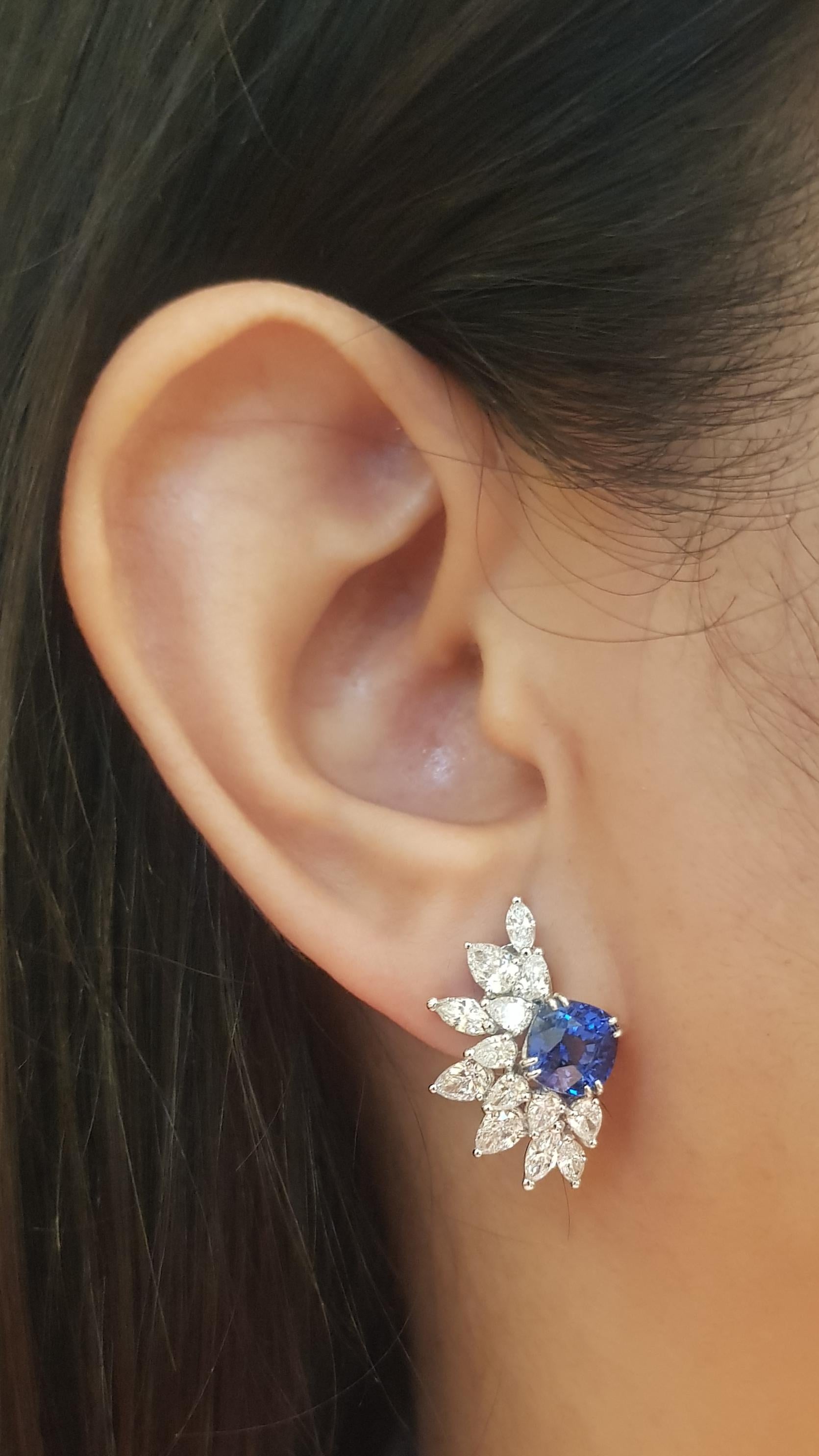 Blue Sapphire 5.18 carats with Diamond 2.66 carats Earrings set in 18K White Gold Settings

Width: 1.5 cm 
Length: 2.3 cm
Total Weight: 8.64 grams

