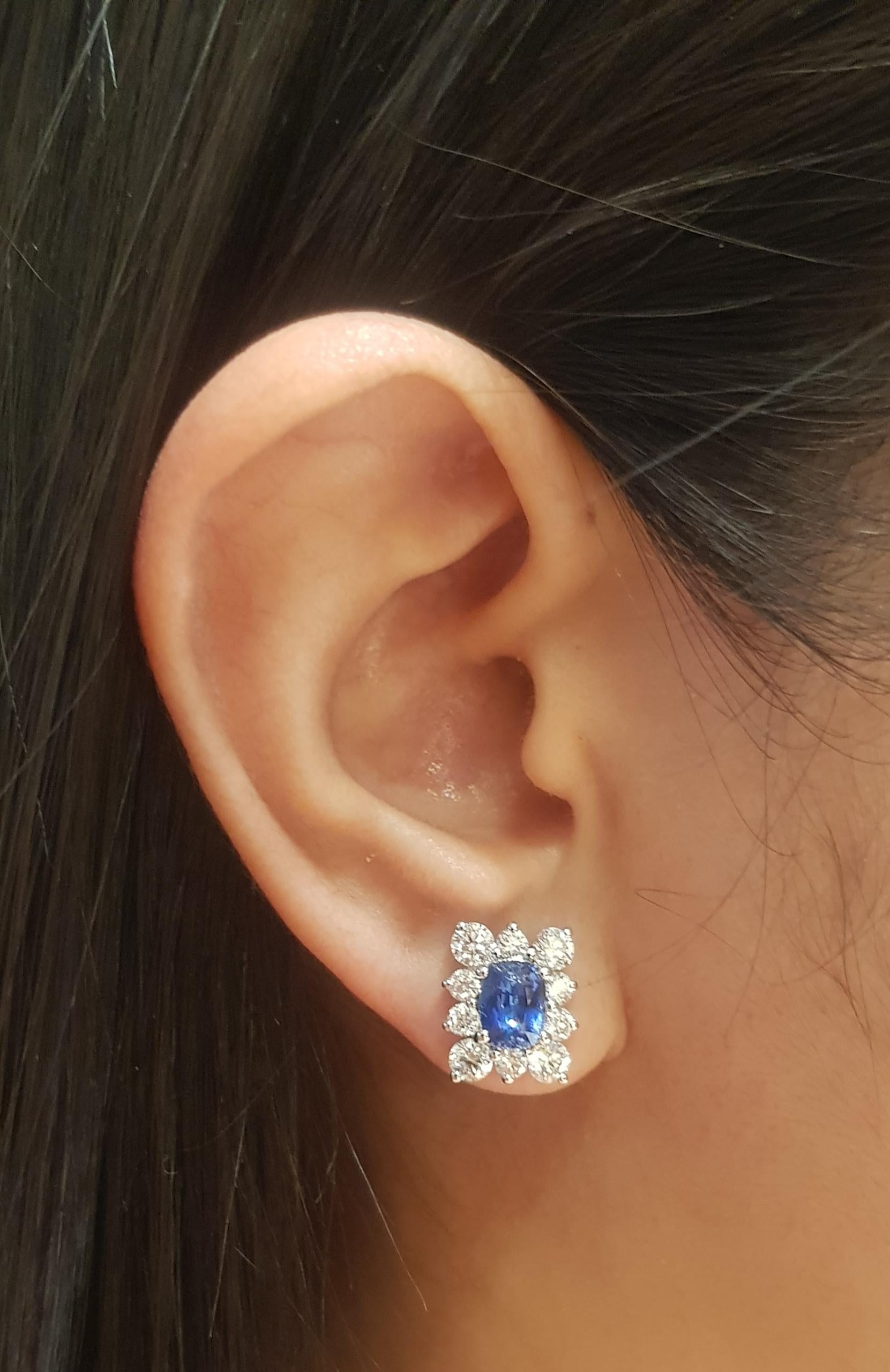 Blue Sapphire 2.18 carats with Diamond 1.83 carats Earrings set in 18K White Gold Settings

Width: 1.1 cm 
Length: 1.3 cm
Total Weight: 5.41 grams


