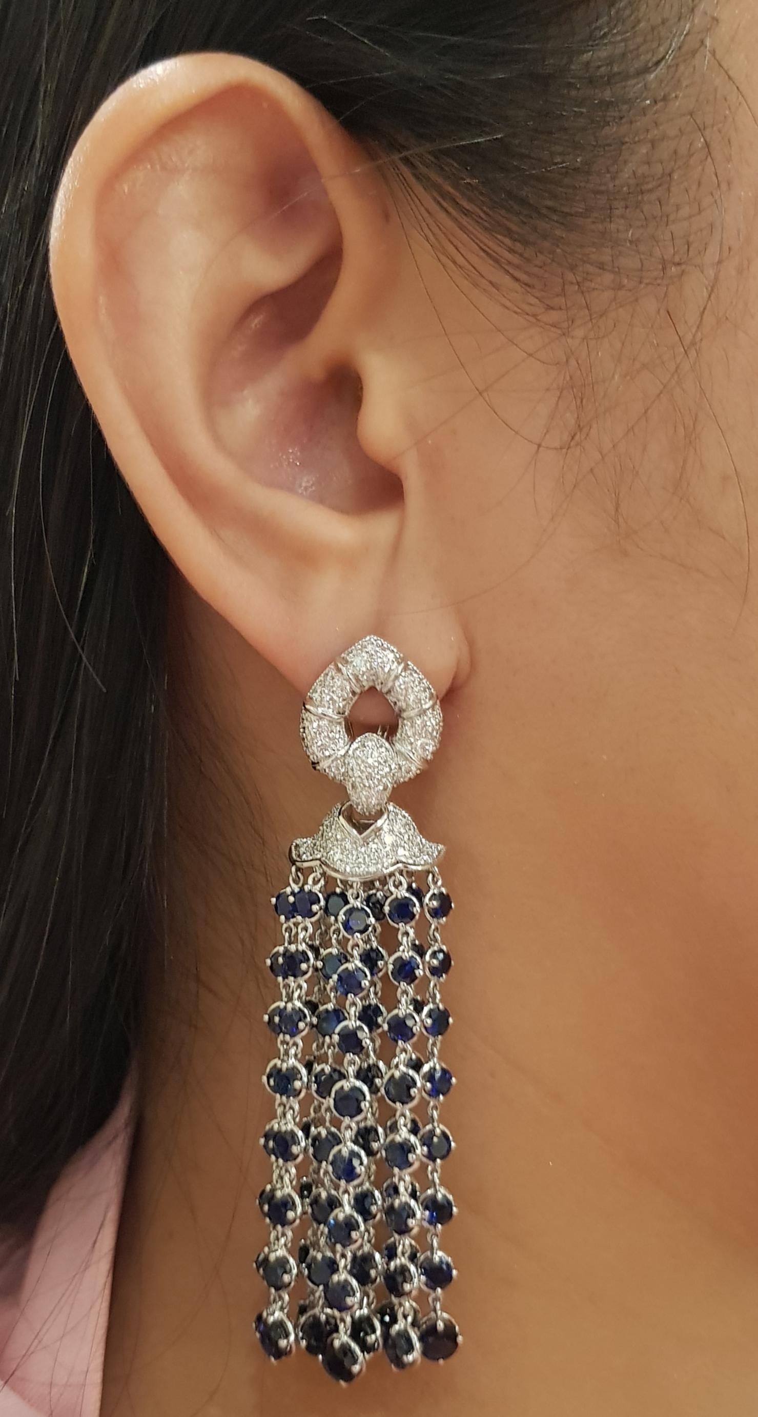 Blue Sapphire 25.54 carats with Diamond 2.03 carats Earrings set in 18K White Gold Settings

Width: 1.7 cm 
Length: 7.2 cm
Total Weight: 40.29 grams

