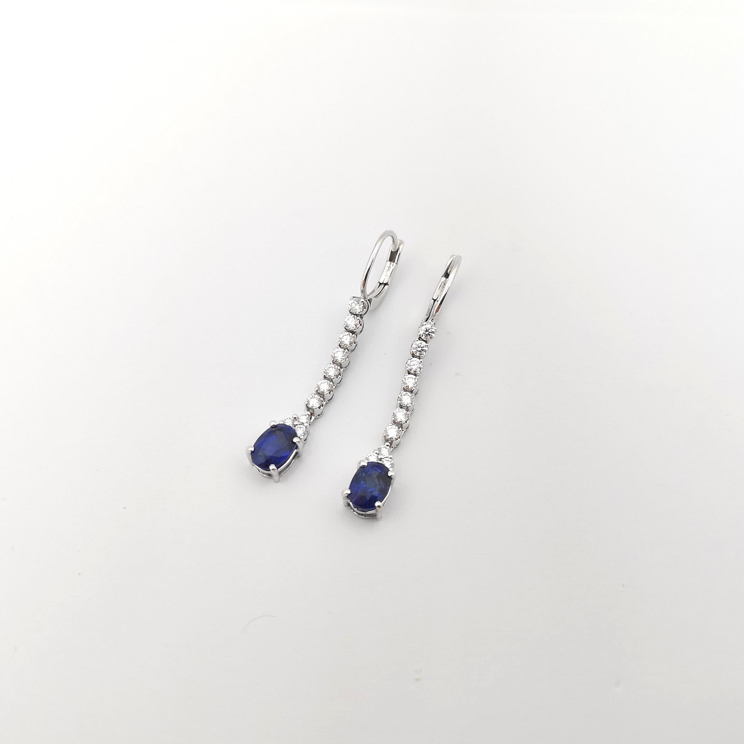 Oval Cut Blue Sapphire with Diamond Earrings set in 18K White Gold Settings For Sale