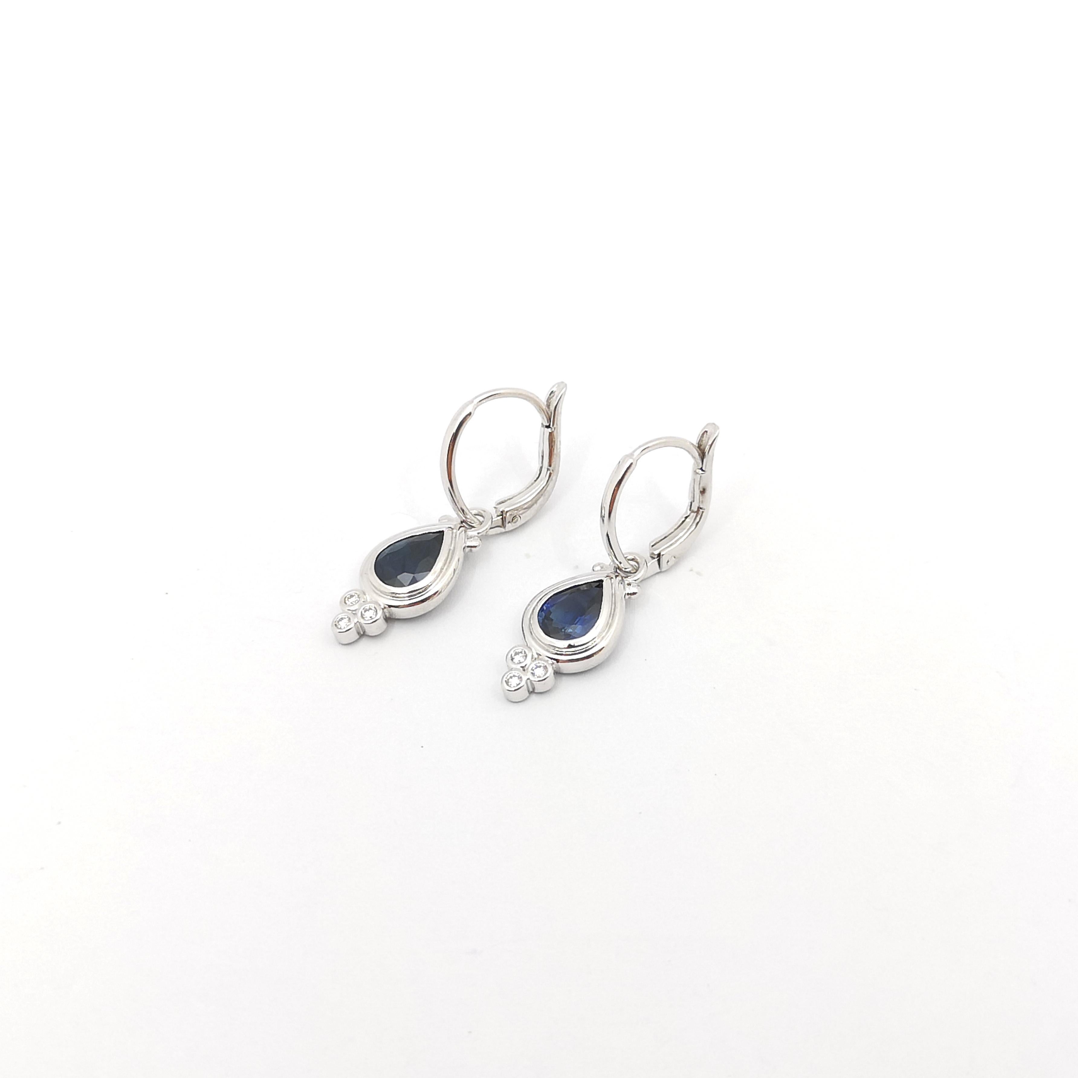 Pear Cut Blue Sapphire with Diamond Earrings set in 18K White Gold Settings For Sale