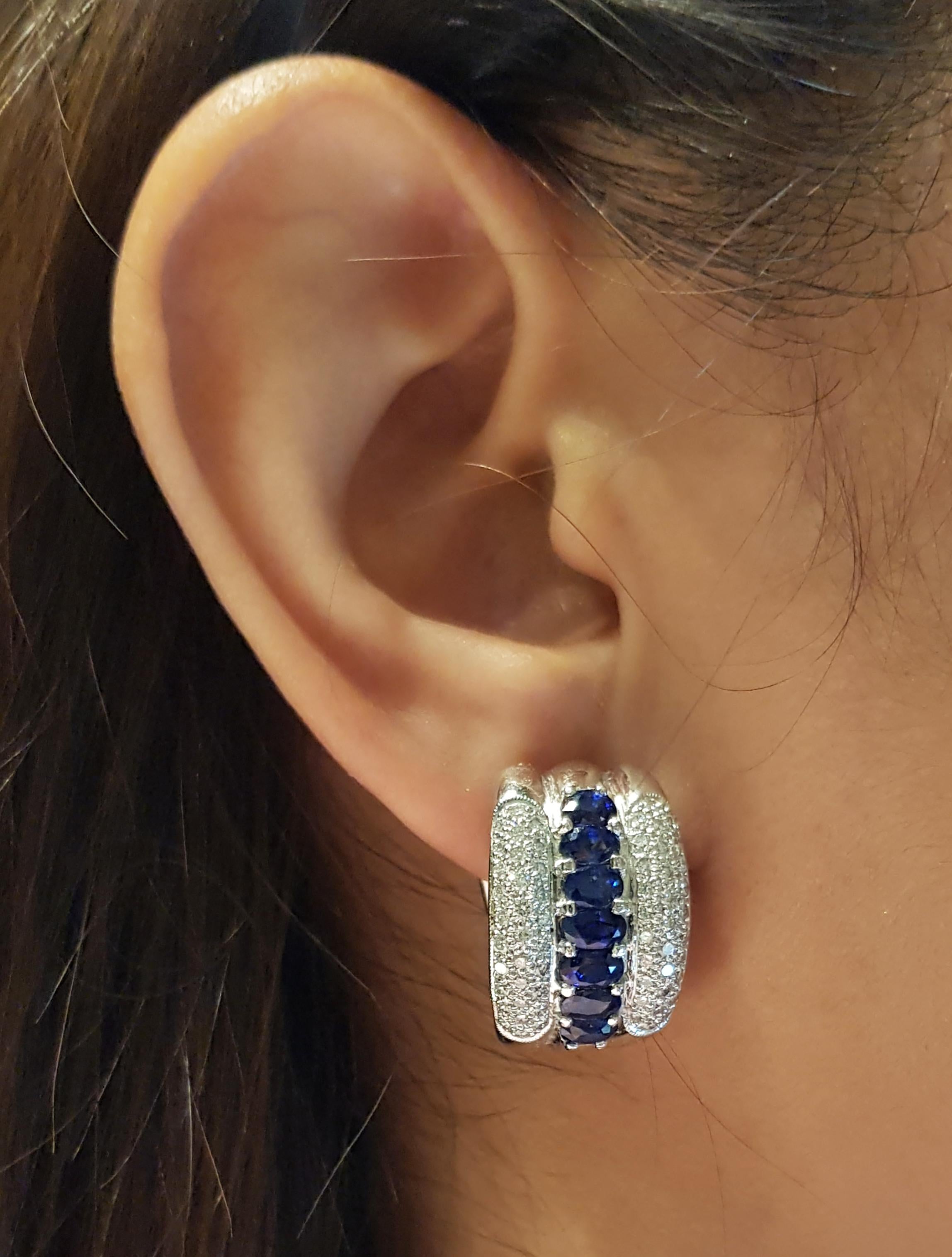 Blue Sapphire 5.35 carats with Diamond 1.33 carats Earrings set in Platinum 900 Settings

Width:  1.4 cm 
Length: 2.3 cm
Total Weight: 32.64 grams

