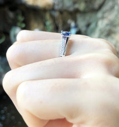 Blue Sapphire with Diamond Engagement Ring Set in 18 Karat White Gold Settings