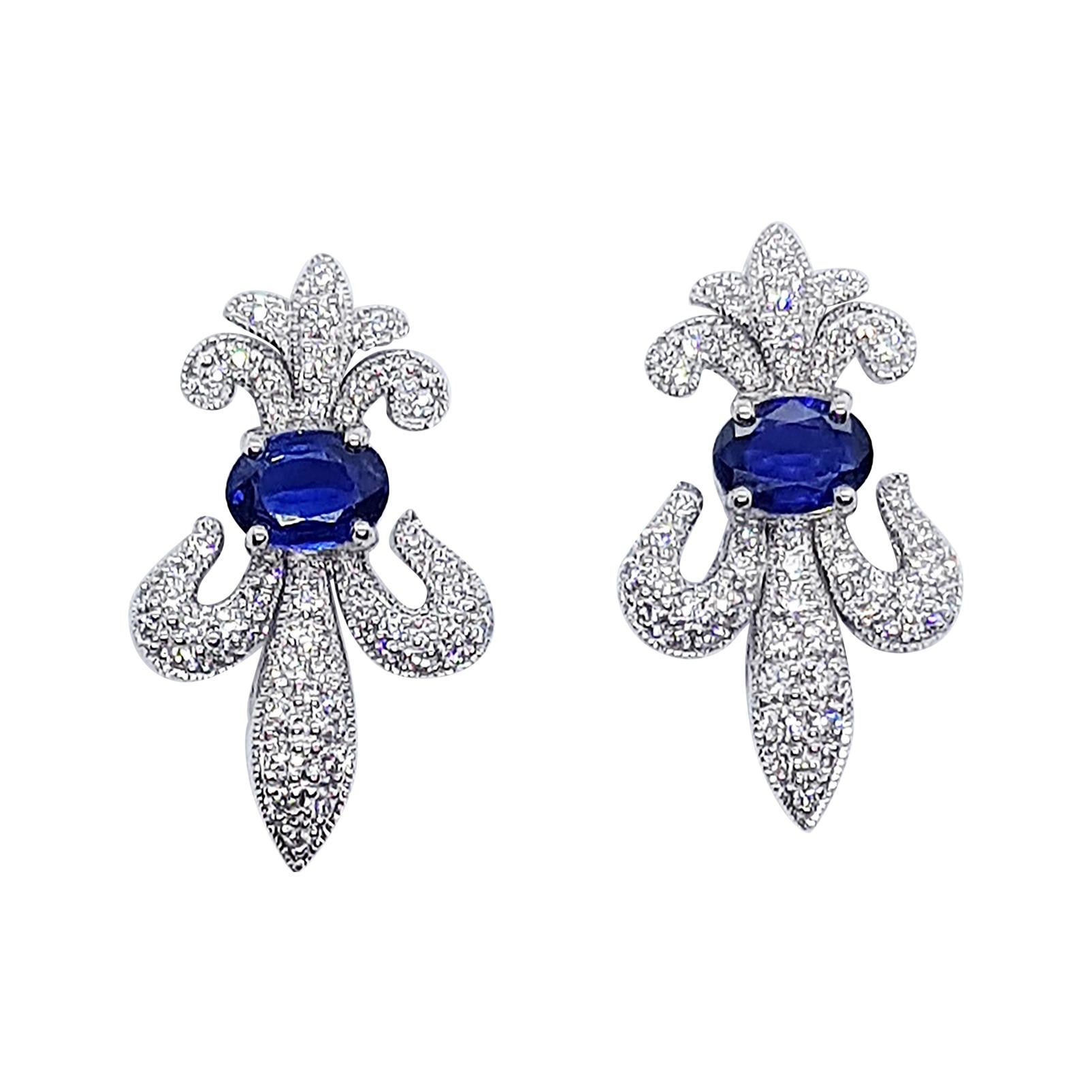Blue Sapphire with Diamond Fleur-de-lis Earrings Set in 18 Karat White Gold For Sale
