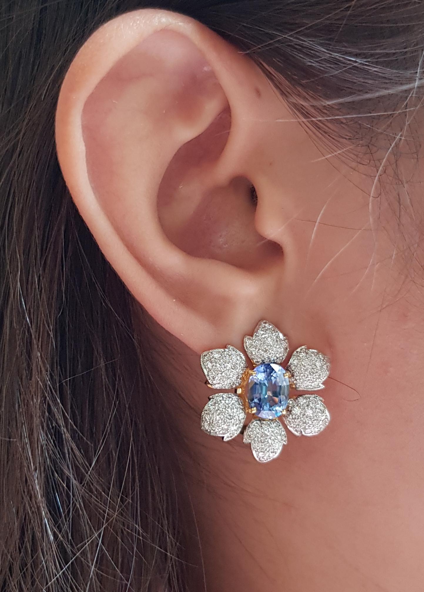 Blue Sapphire 4.79 carats with Diamond 2.03 carats Earrings set in 18 Karat Gold Settings

Width:  2.2 cm 
Length: 2.4 cm
Total Weight: 12.35 grams

