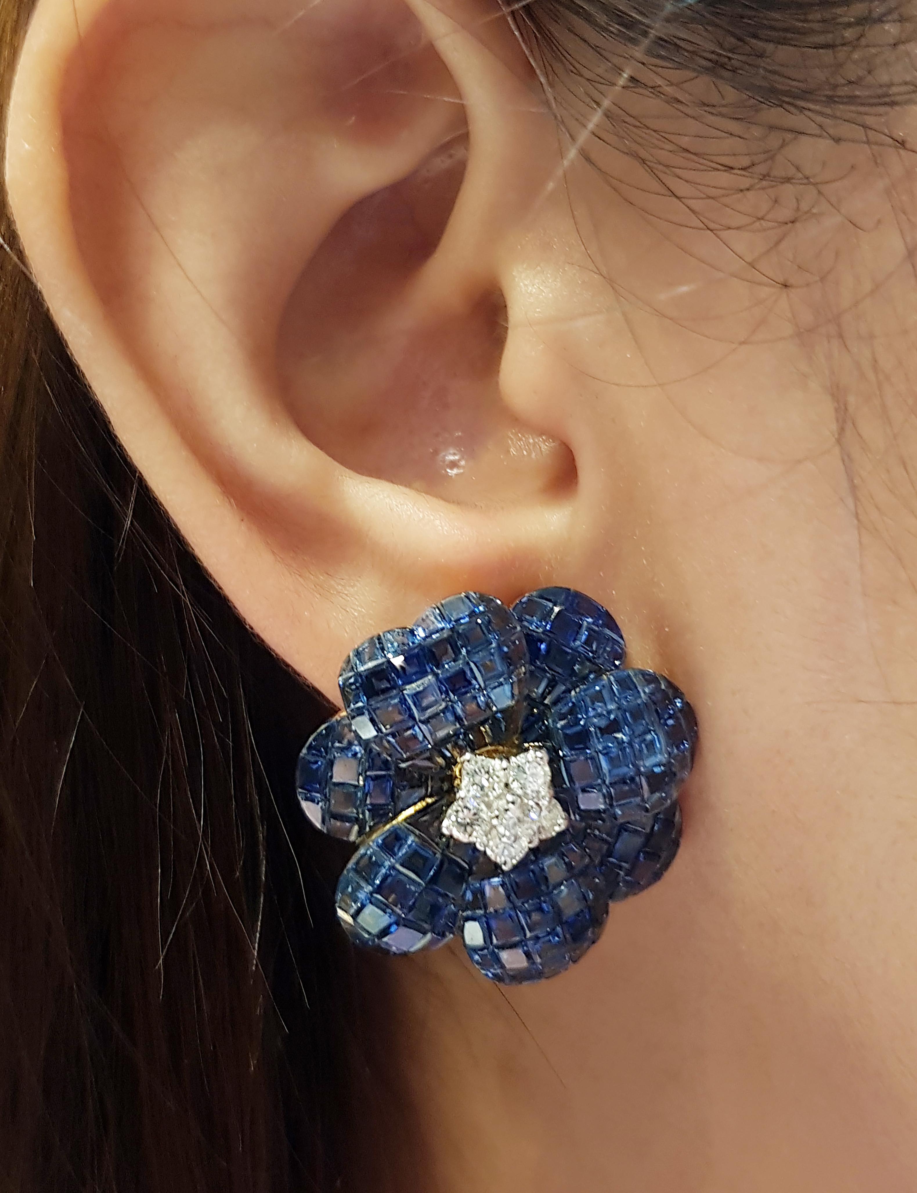 Blauer Saphir 61,70 Karat mit Diamant 0,80 Karat Ohrringe in 18 Karat Goldfassung

Breite: 2,6 cm 
Länge: 2,6 cm
Gesamtgewicht: 22,95 Gramm

