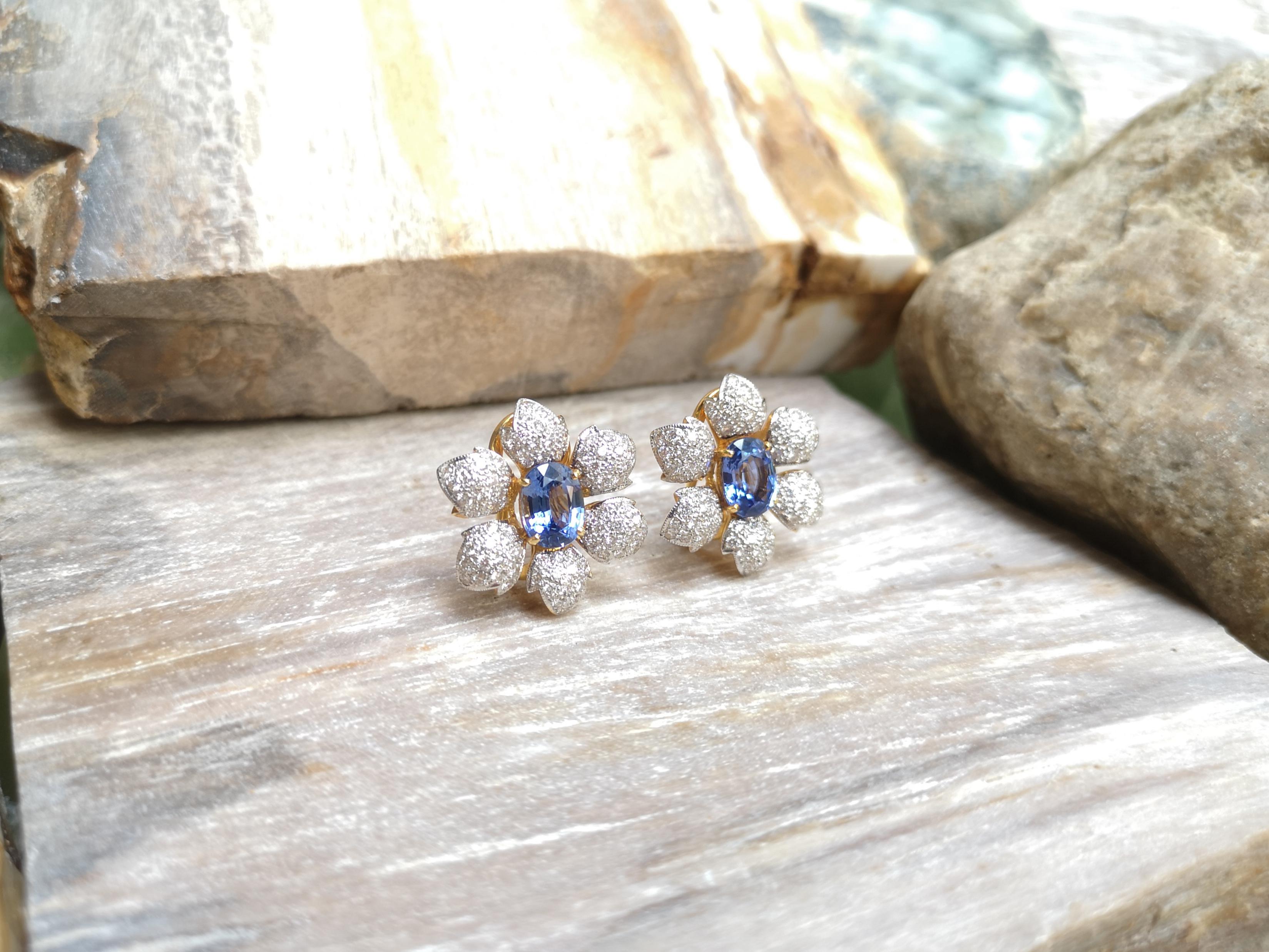 Oval Cut Blue Sapphire with Diamond Flower Earrings Set in 18 Karat Gold Settings For Sale