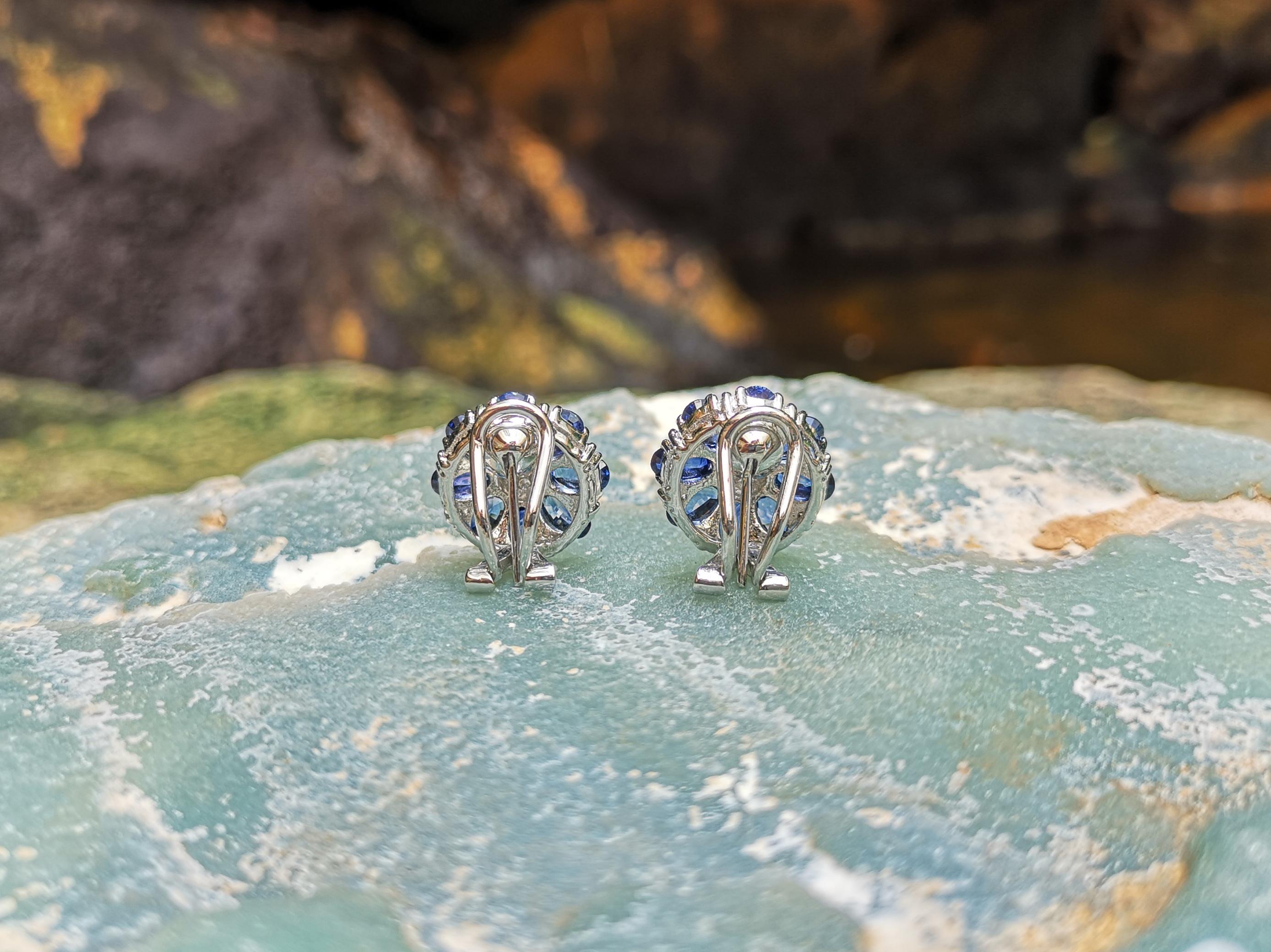 Oval Cut Blue Sapphire with Diamond Flower Earrings Set in 18 Karat White Gold Settings For Sale
