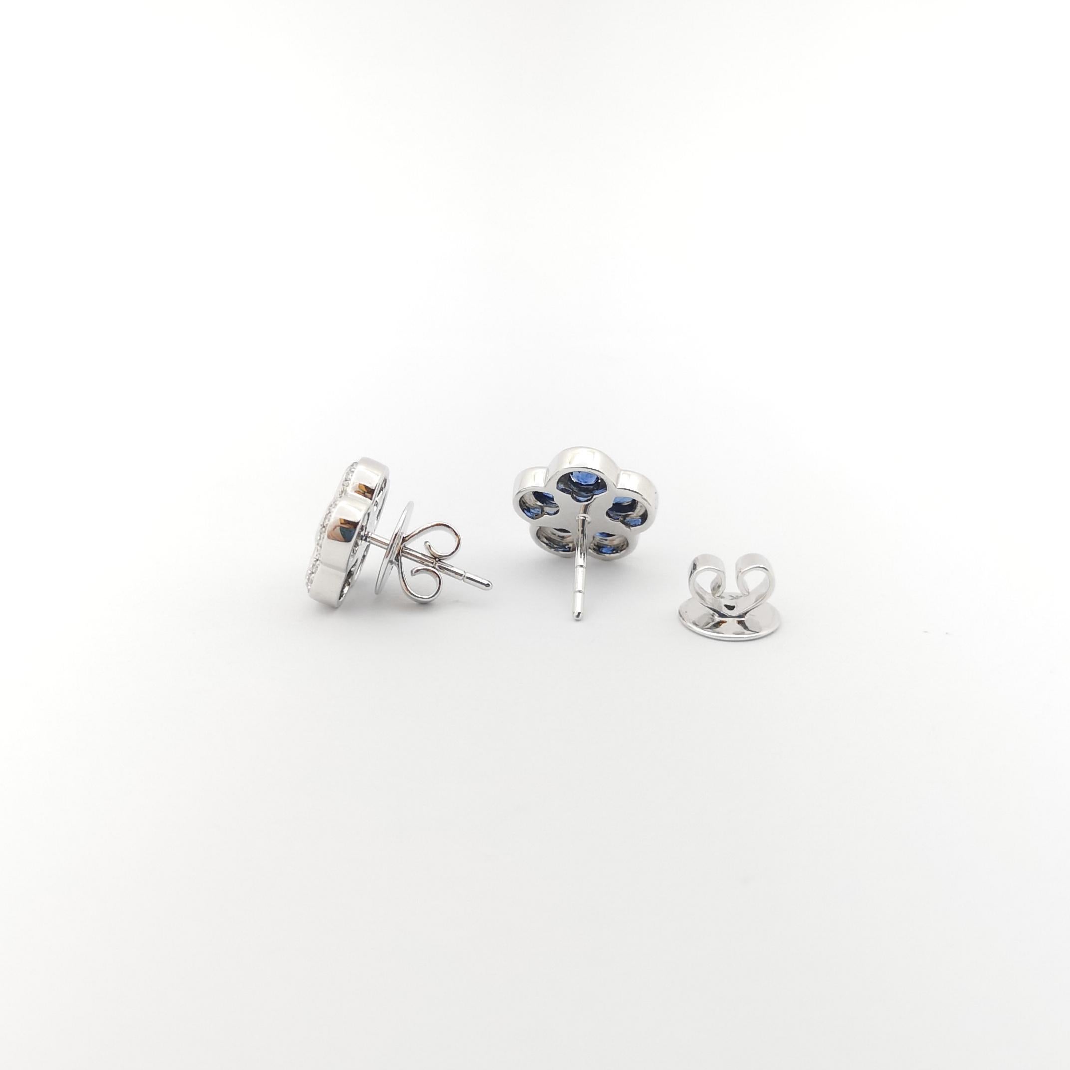 Women's Blue Sapphire with Diamond Flower Earrings set in 18K White Gold Settings For Sale