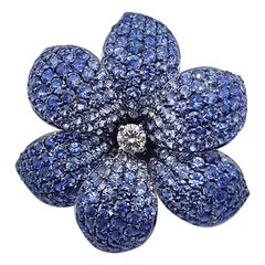 Blue Sapphire with Diamond Flower Pendant Set in 18 Karat White Settings