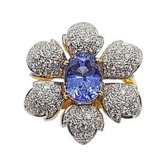 Blue Sapphire with Diamond Flower Ring Set in 18 Karat Gold Settings