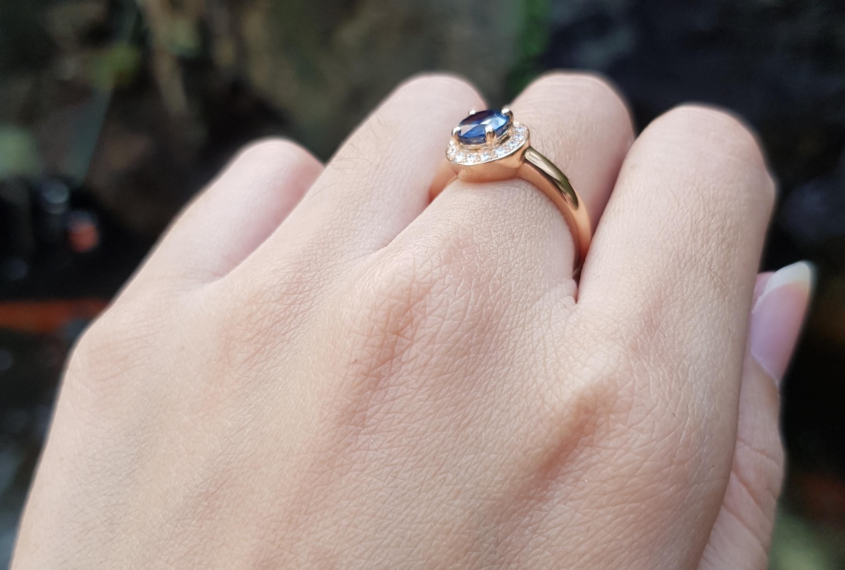 Round Cut Blue Sapphire with Diamond Halo Ring Set in 18 Karat Rose Gold Settings For Sale