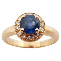Blue Sapphire with Diamond Halo Ring Set in 18 Karat Rose Gold Settings