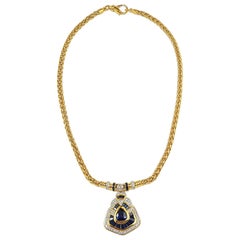 Collier en or 18 carats serti d'un saphir bleu et de diamants