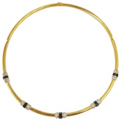 Collier en or 18 carats serti d'un saphir bleu et de diamants