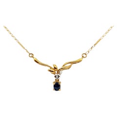 Collana di zaffiri blu e diamanti con montatura in oro 18 carati