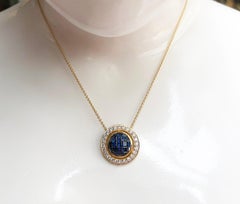 Blue Sapphire with Diamond Pendant Set in 18 Karat Gold Settings