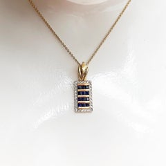 Blue Sapphire with Diamond Pendant Set in 18 Karat Gold Settings