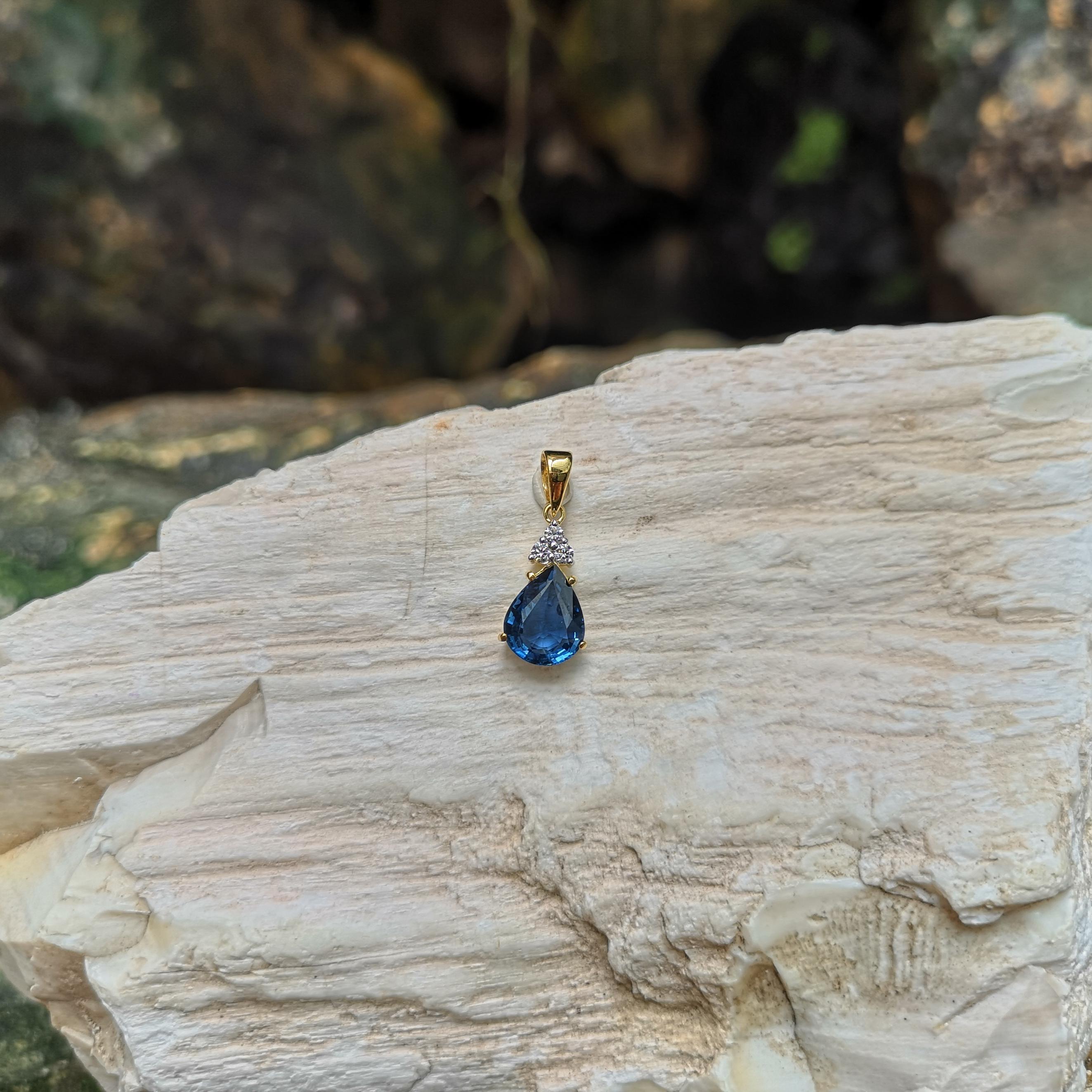 Pear Cut Blue Sapphire with Diamond Pendant Set in 18 Karat Gold Settings