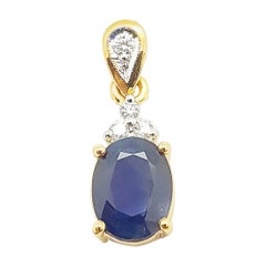 Blue Sapphire with Diamond Pendant Set in 18 Karat Gold Settings