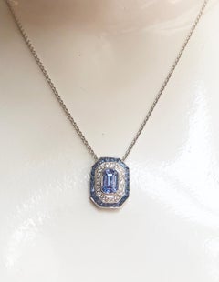 Blue Sapphire with Diamond Pendant Set in 18 Karat White Gold Settings