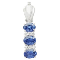 Blue Sapphire with Diamond Pendant set in 18K White Gold Settings
