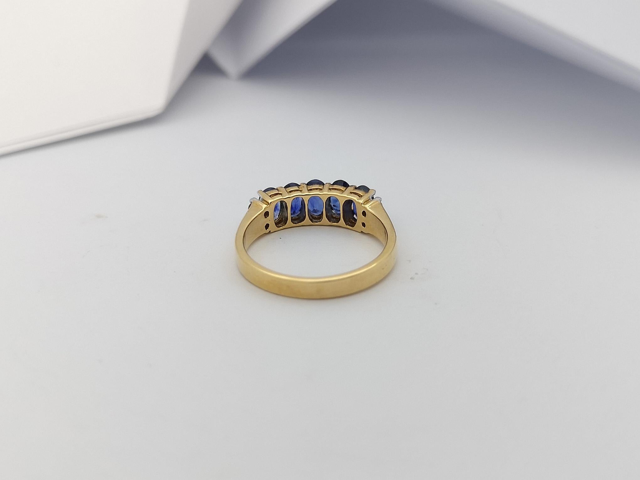 Bague en or 18 carats sertie d'un saphir bleu et de diamants en vente 4