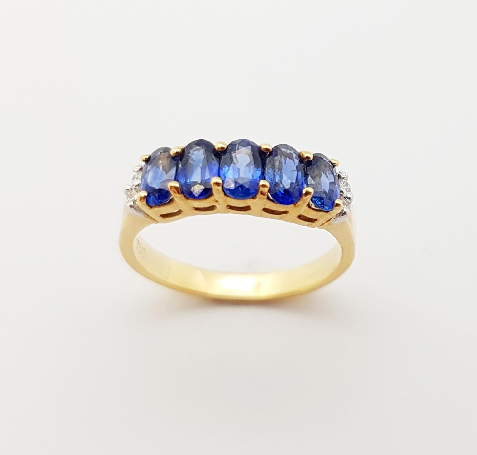 Bague en or 18 carats sertie d'un saphir bleu et de diamants en vente 5