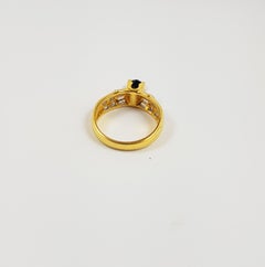 Blue Sapphire with Diamond Ring Set in 18 Karat Gold Settings