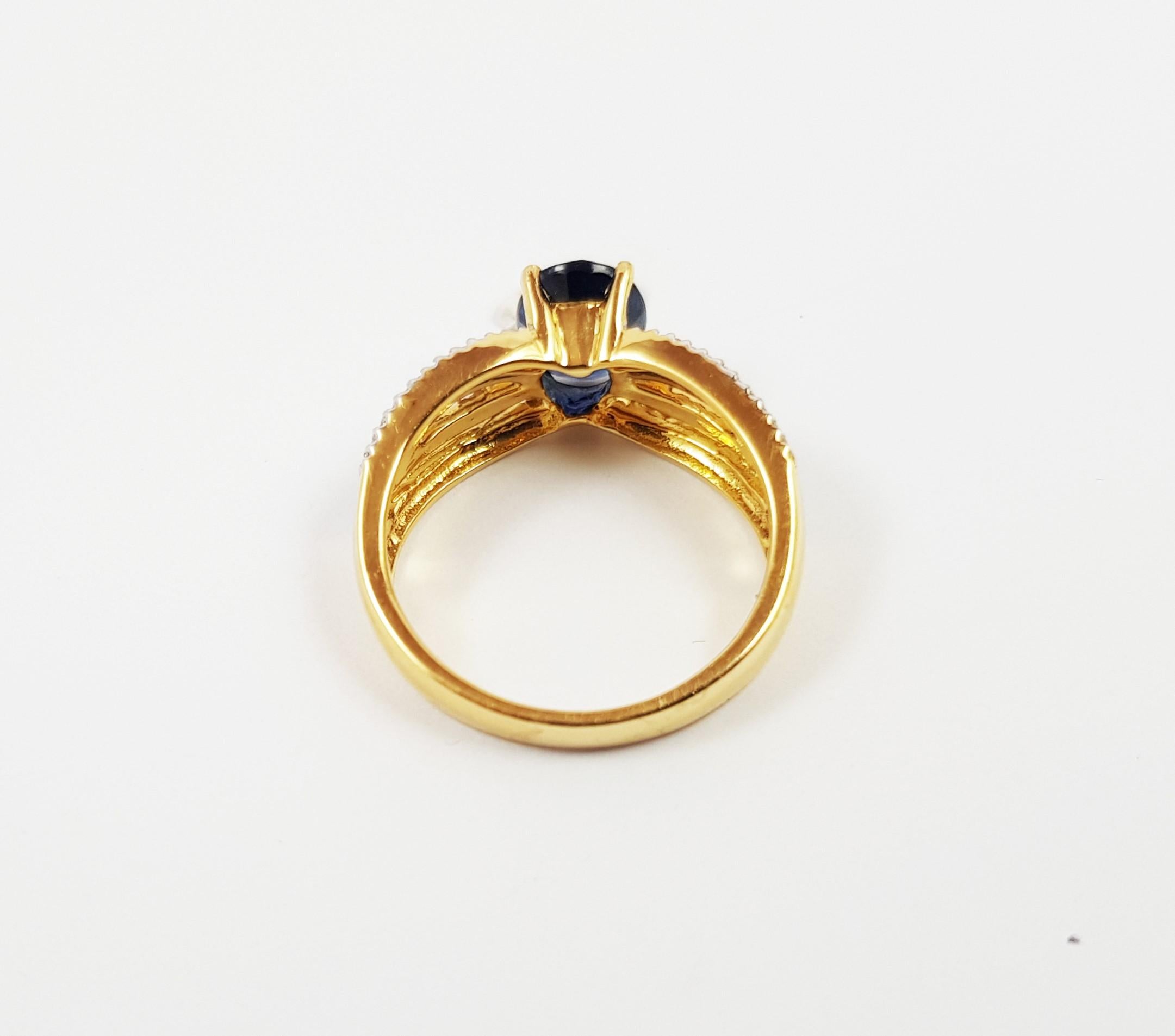 Bague en or 18 carats sertie d'un saphir bleu de 1,81 carat et d'un diamant de 0,24 carat

Largeur : 0,6 cm
Longueur : 0,8 cm 
Taille de l'anneau : 53


