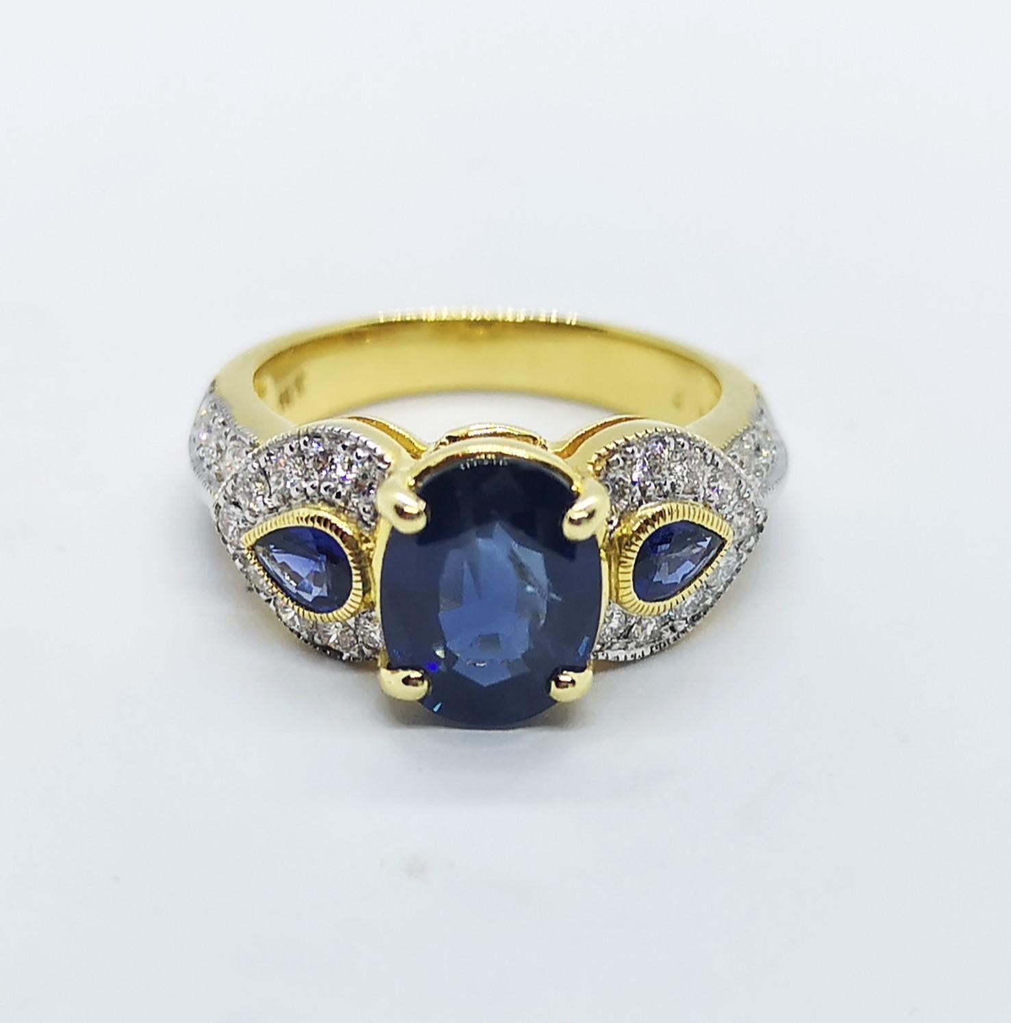 Blue Sapphire 2.60 carats with Blue Sapphire 0.34 carat and Diamond 0.45 carat Ring set in 18 Karat Gold Settings

Width: 0.6 cm
Length: 0.9 cm 
Ring Size: 50

