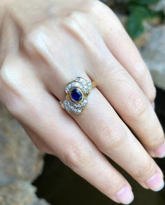 Blue Sapphire with Diamond Ring Set in 18 Karat Gold Settings