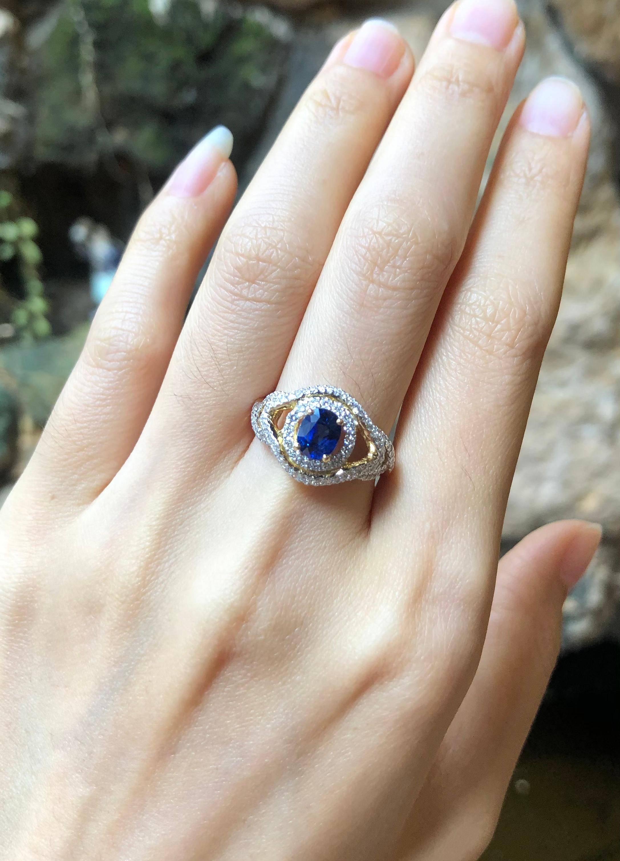 Blue sapphire 1.05 carats with Diamond 0.58 carat Ring set in 18 Karat Gold Settings

Width:  0.5 cm 
Length: 0.7 cm
Ring Size: 54
Total Weight: 4.88 grams

