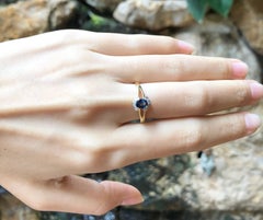Blue Sapphire with Diamond Ring Set in 18 Karat Gold Settings