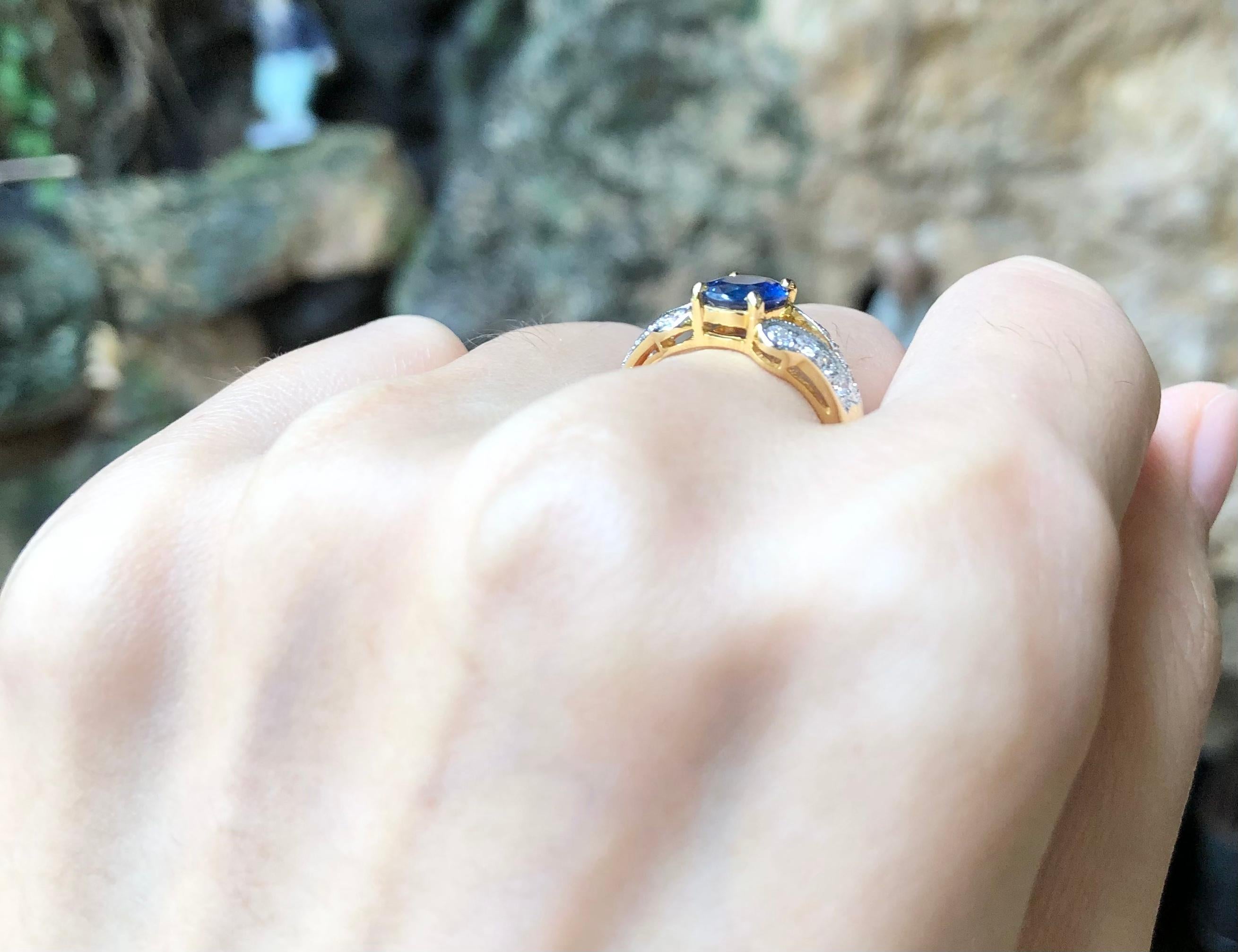 Oval Cut Blue Sapphire with Diamond Ring Set in 18 Karat Gold Settings For Sale