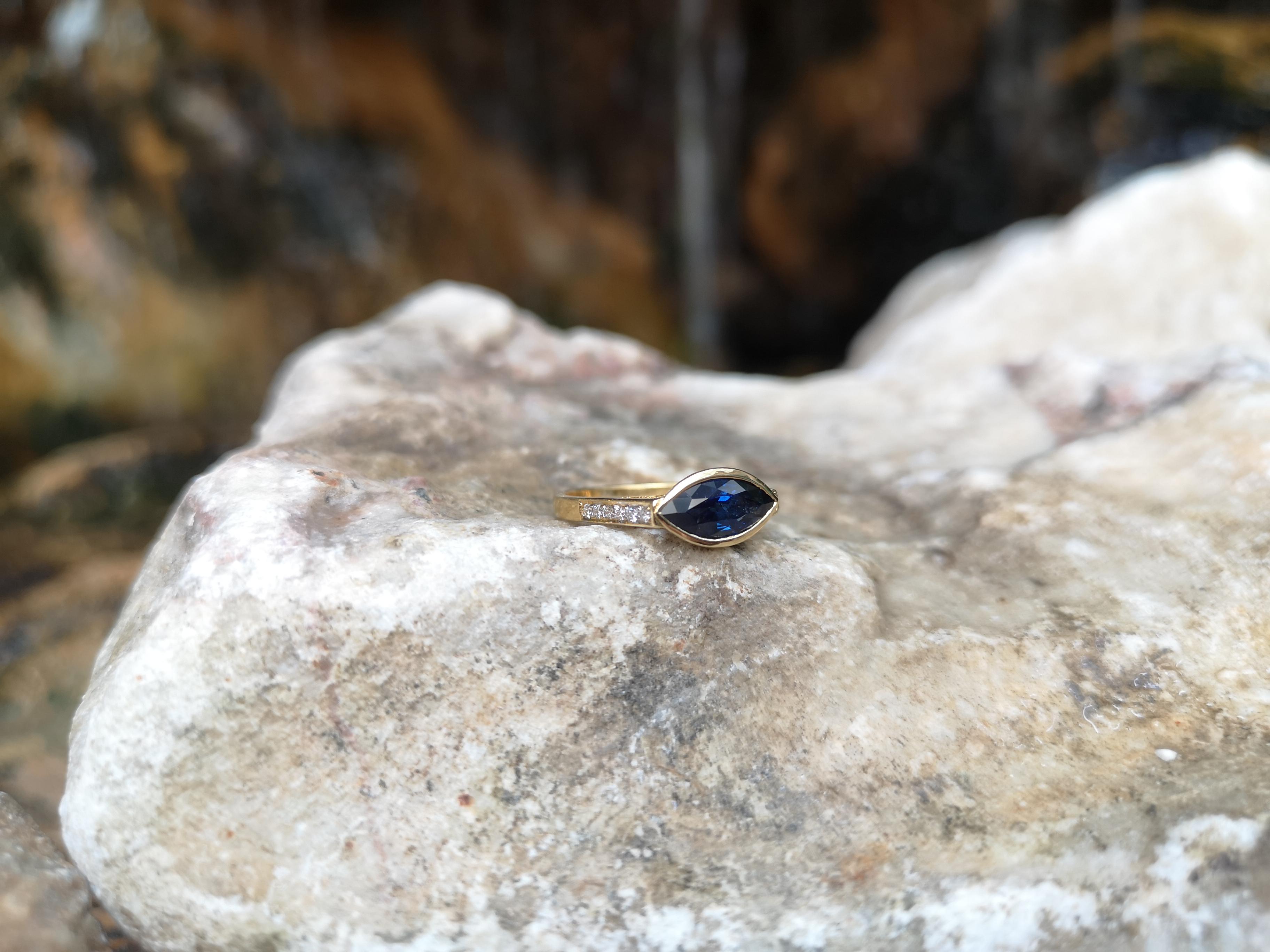 Marquise Cut Blue Sapphire with Diamond Ring Set in 18 Karat Gold Settings For Sale
