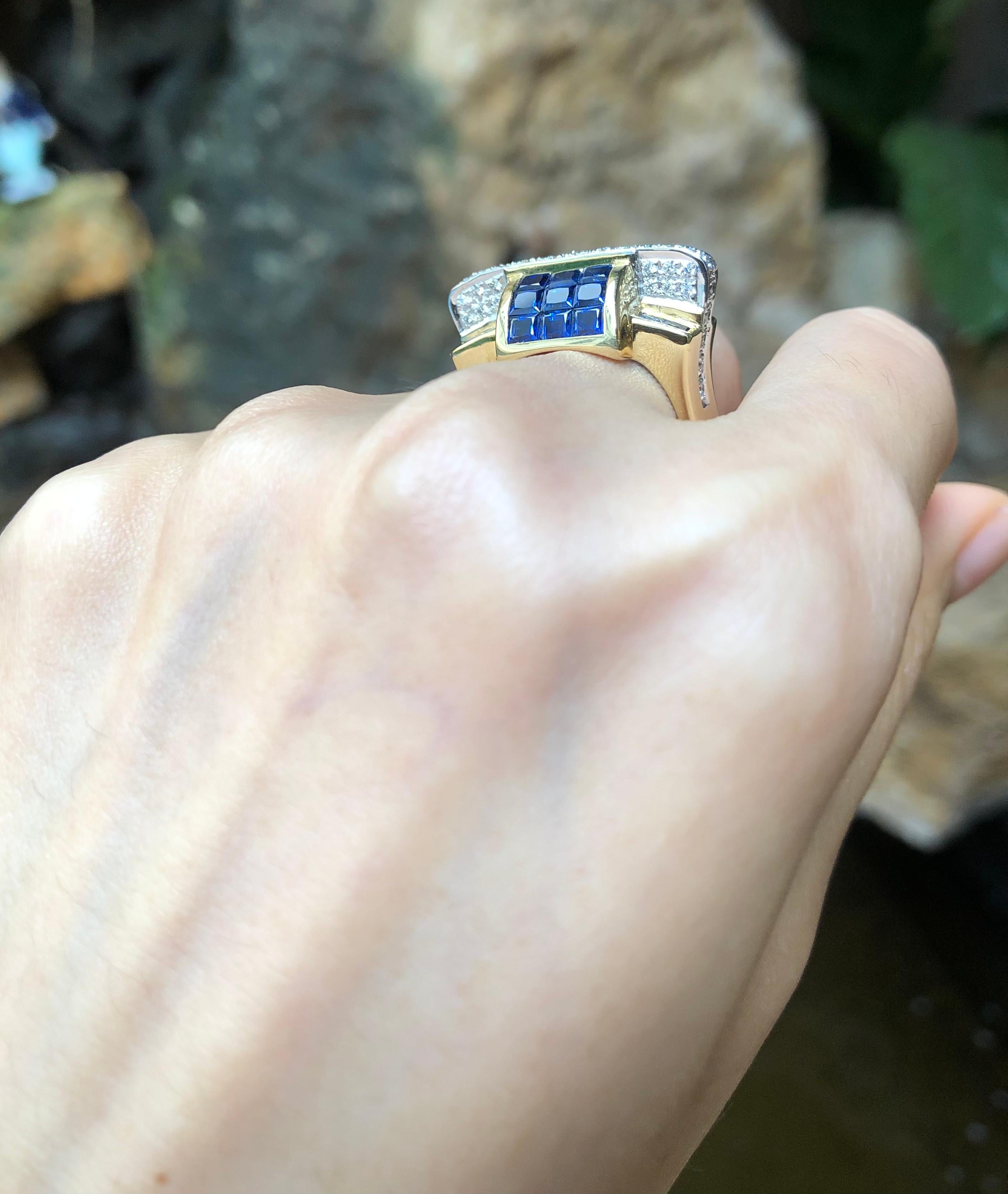 Bague en or 18 carats sertie d'un saphir bleu et de diamants Unisexe en vente