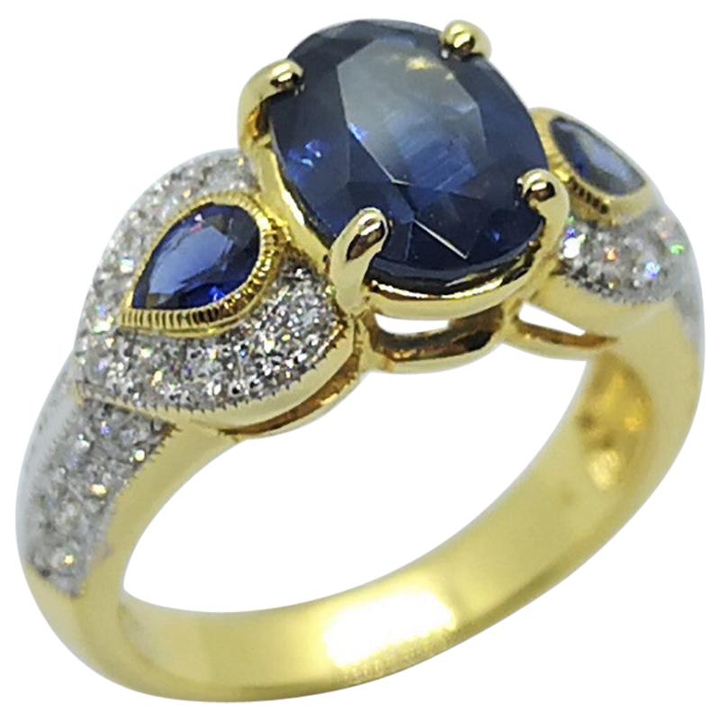 Blue Sapphire with Diamond Ring Set in 18 Karat Gold Settings For Sale