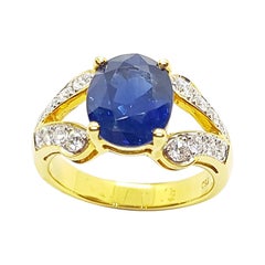 Bague en or 18 carats sertie d'un saphir bleu et de diamants