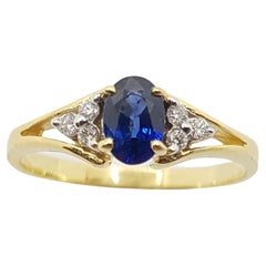 Bague en or 18 carats sertie d'un saphir bleu et de diamants