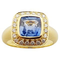 Bague en or 18 carats sertie d'un saphir bleu et de diamants