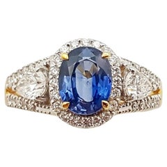 Bague en or 18 carats sertie d'un saphir bleu et de diamants