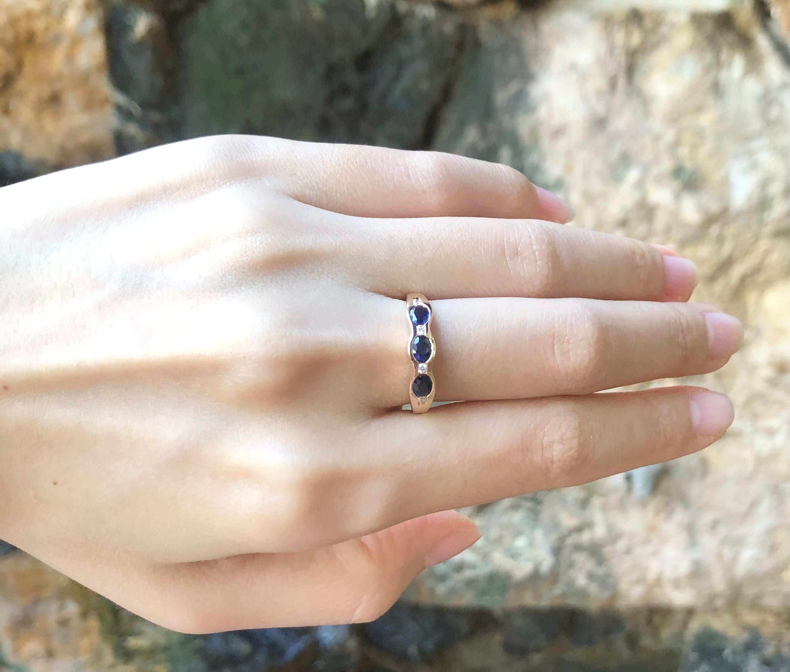 Contemporary Blue Sapphire with Diamond Ring Set in 18 Karat Rose Gold Settings For Sale