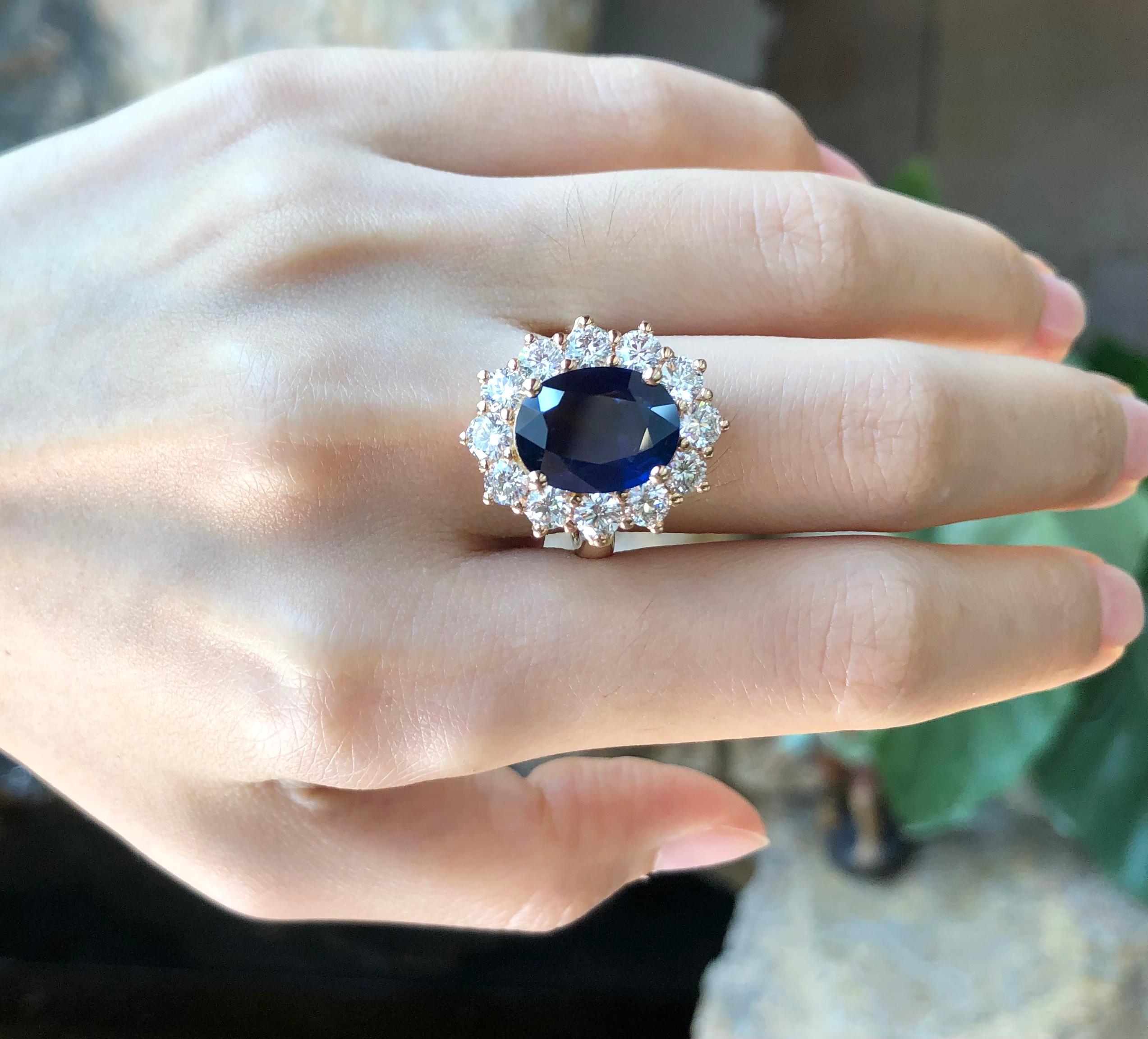 Oval Cut Blue Sapphire with Diamond Ring set in 18 Karat Rose Gold Settings For Sale