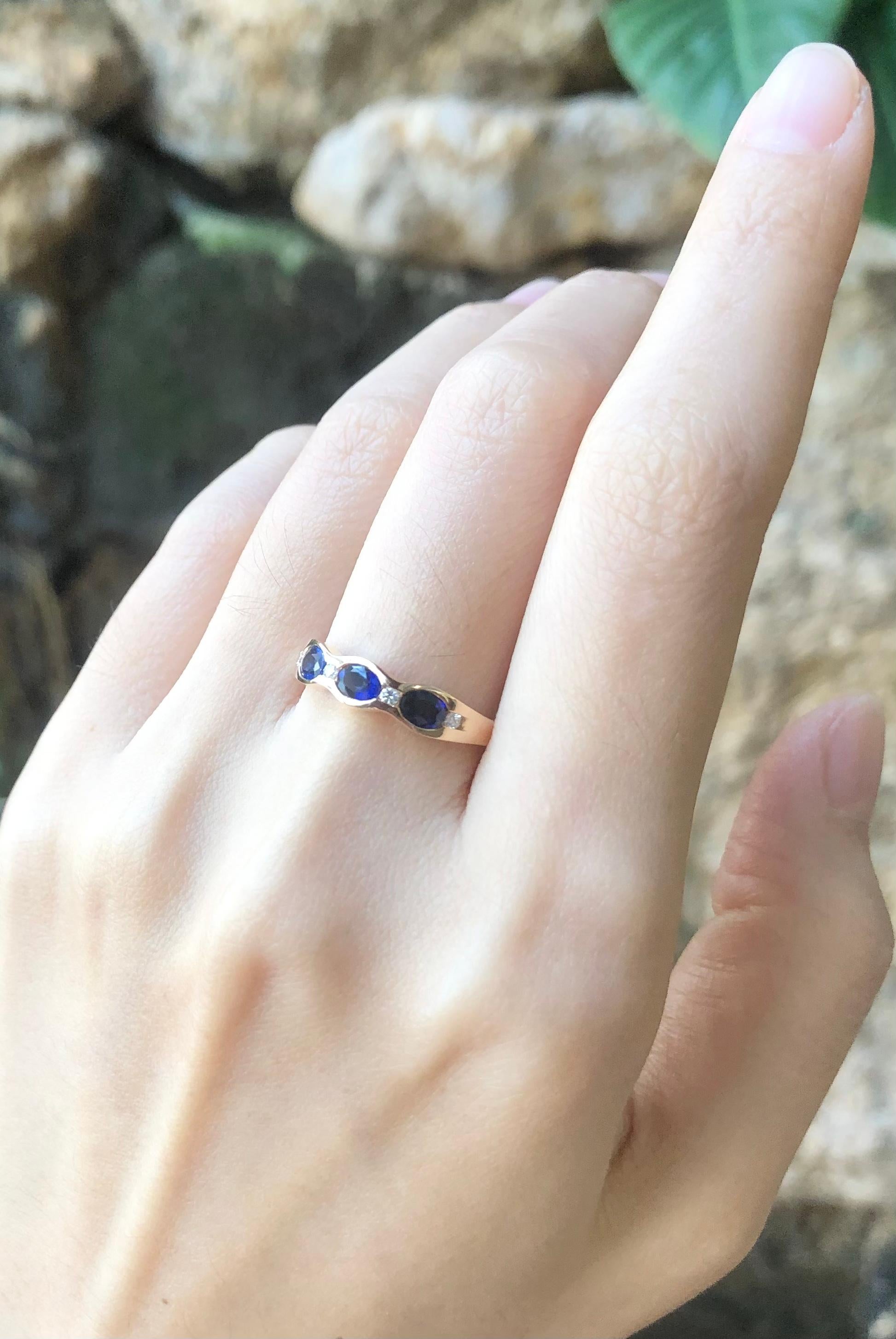 Oval Cut Blue Sapphire with Diamond Ring Set in 18 Karat Rose Gold Settings For Sale