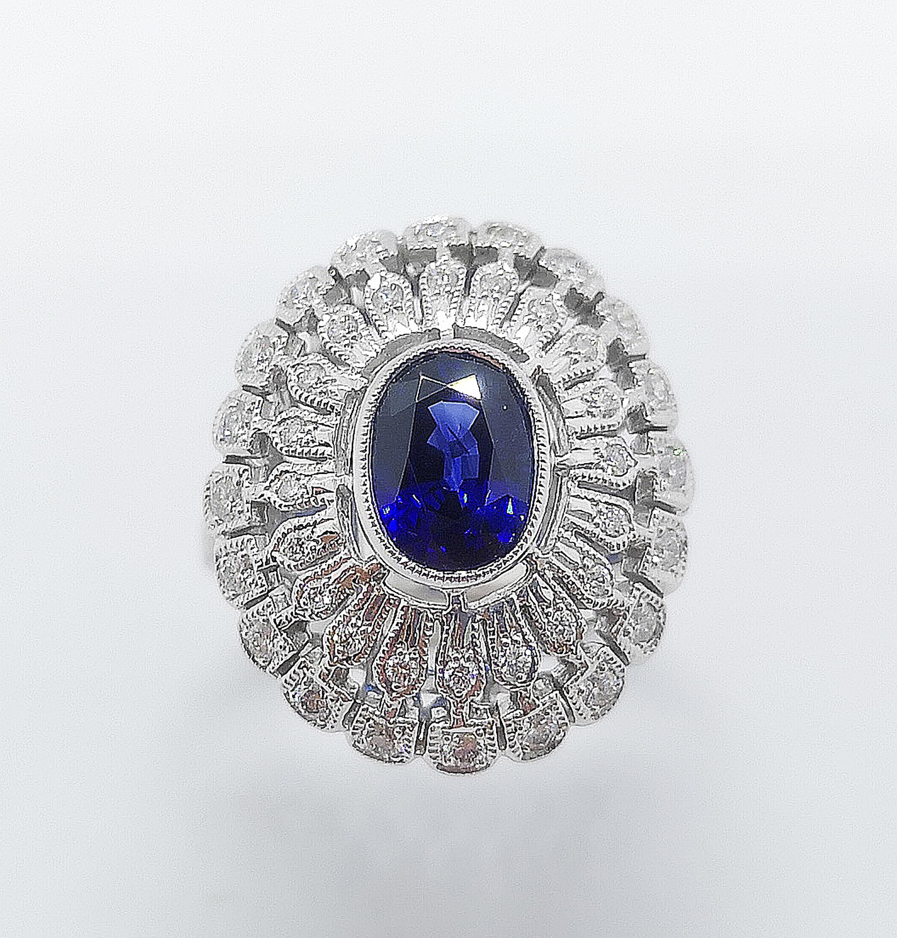 Blue Sapphire 2.06 carats with Diamond 0.52 carat Ring set in 18 Karat White Gold Settings

Width:  1.7 cm 
Length: 2.1 cm
Ring Size: 53
Total Weight: 10.46 grams

